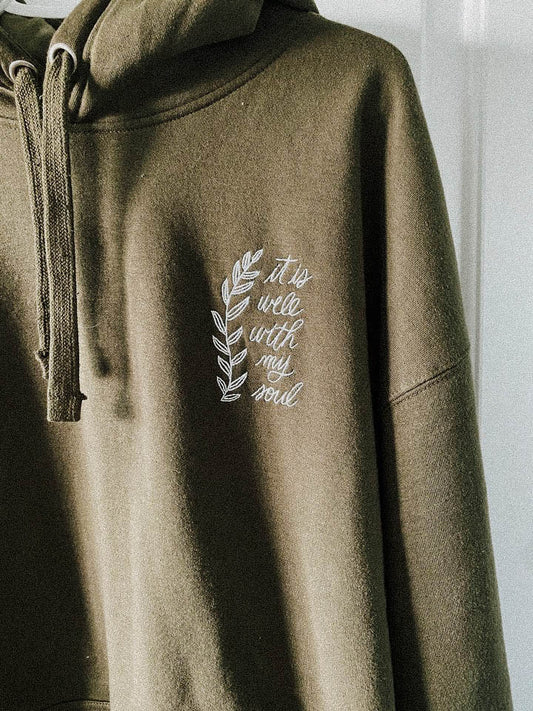 Military Green Hoodie with It Is Well With My Soul Embroidered on the right chest.